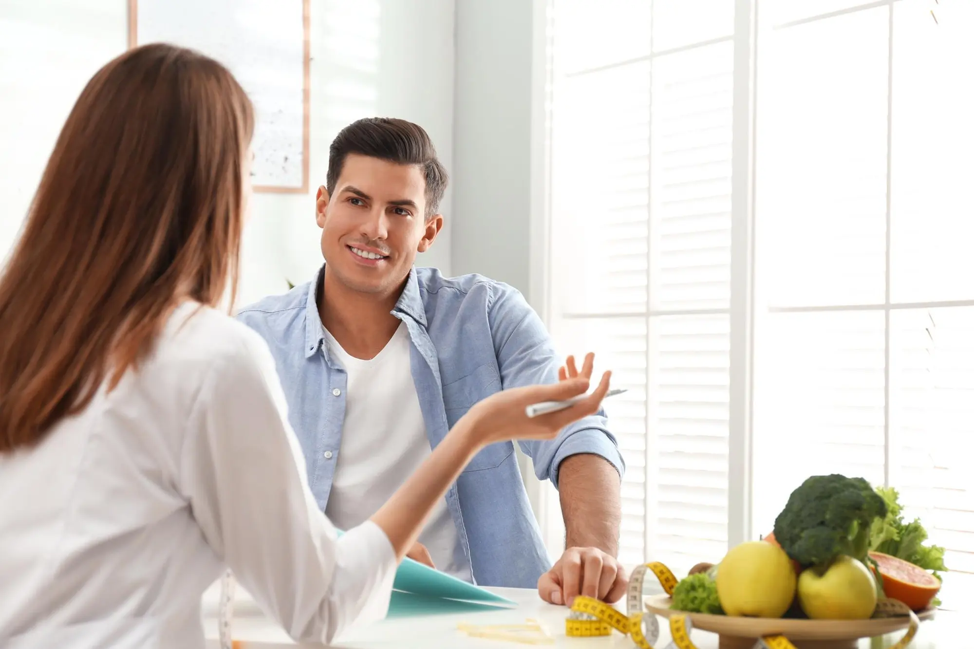 Couple having a thoughtful discussion about maintaining a healthy lifestyle.