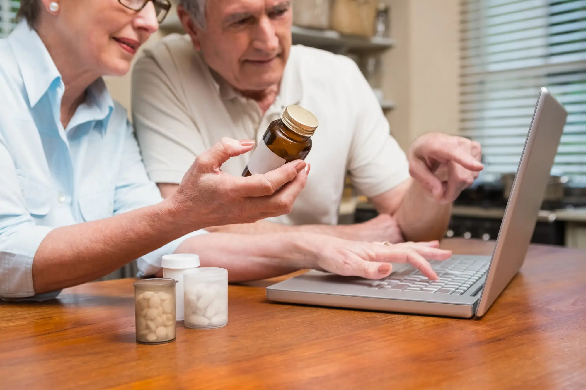 Couple receiving online medical guidance from their doctor regarding prescriptions.