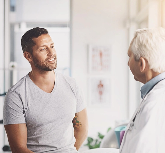 Supportive medical consultation representing personalized erectile dysfunction treatment options and men's health care.