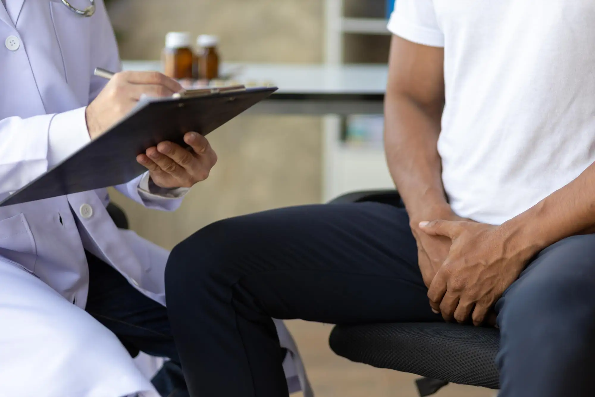 Discreet medical evaluation representing a personalized erectile dysfunction treatment consultation in a supportive setting.