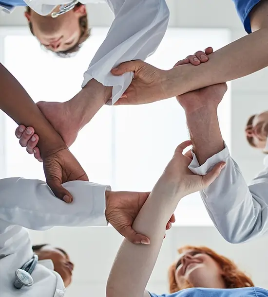 doctors holding hand making vision sign to show mission statement
