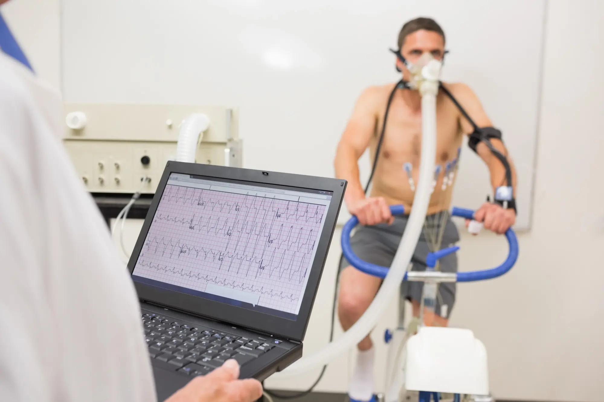 Patient using comprehensive physical exam machine for full-body health screening.