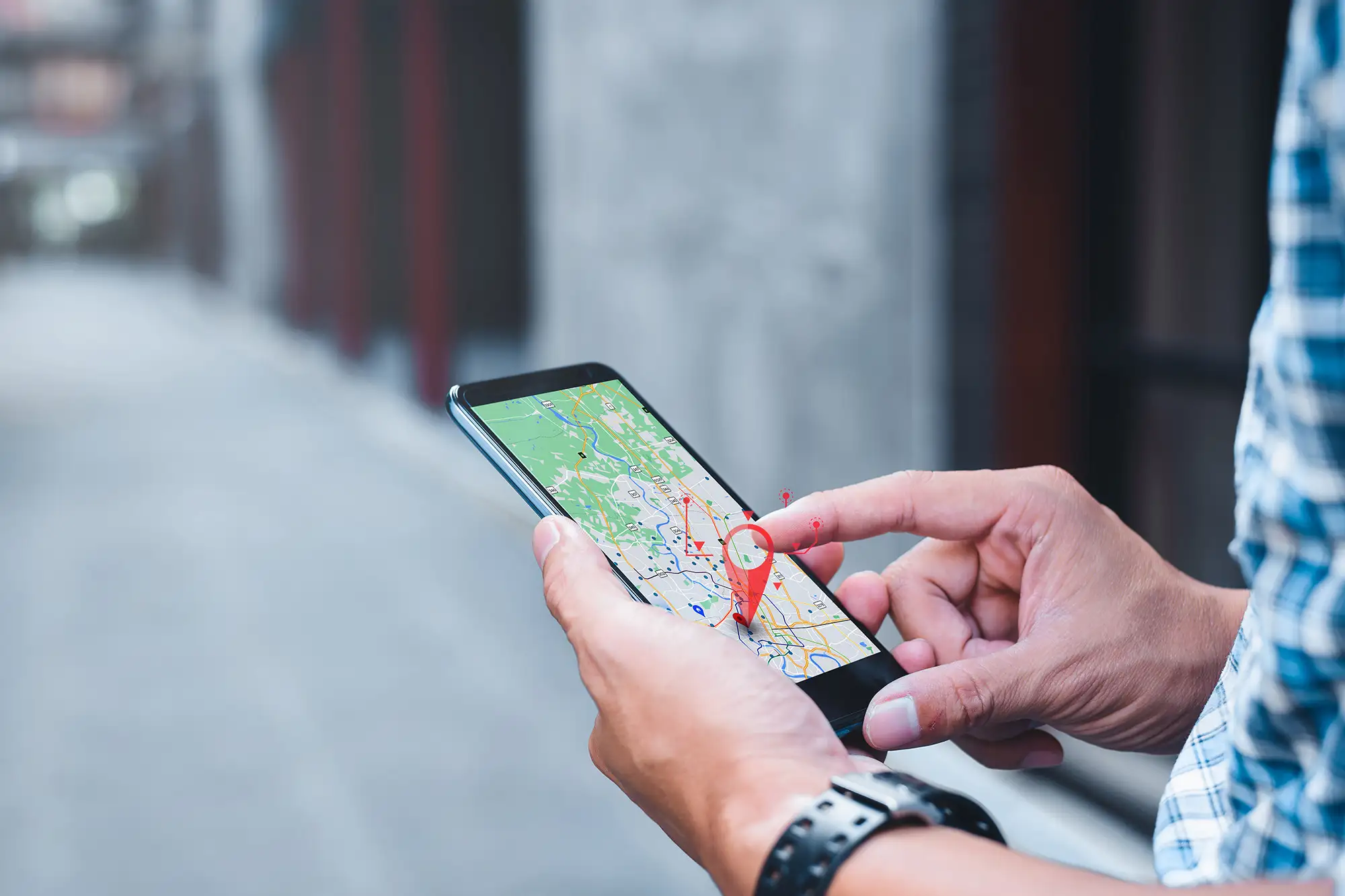 Person using Google Maps on a smartphone to find local and nearby healthcare services.