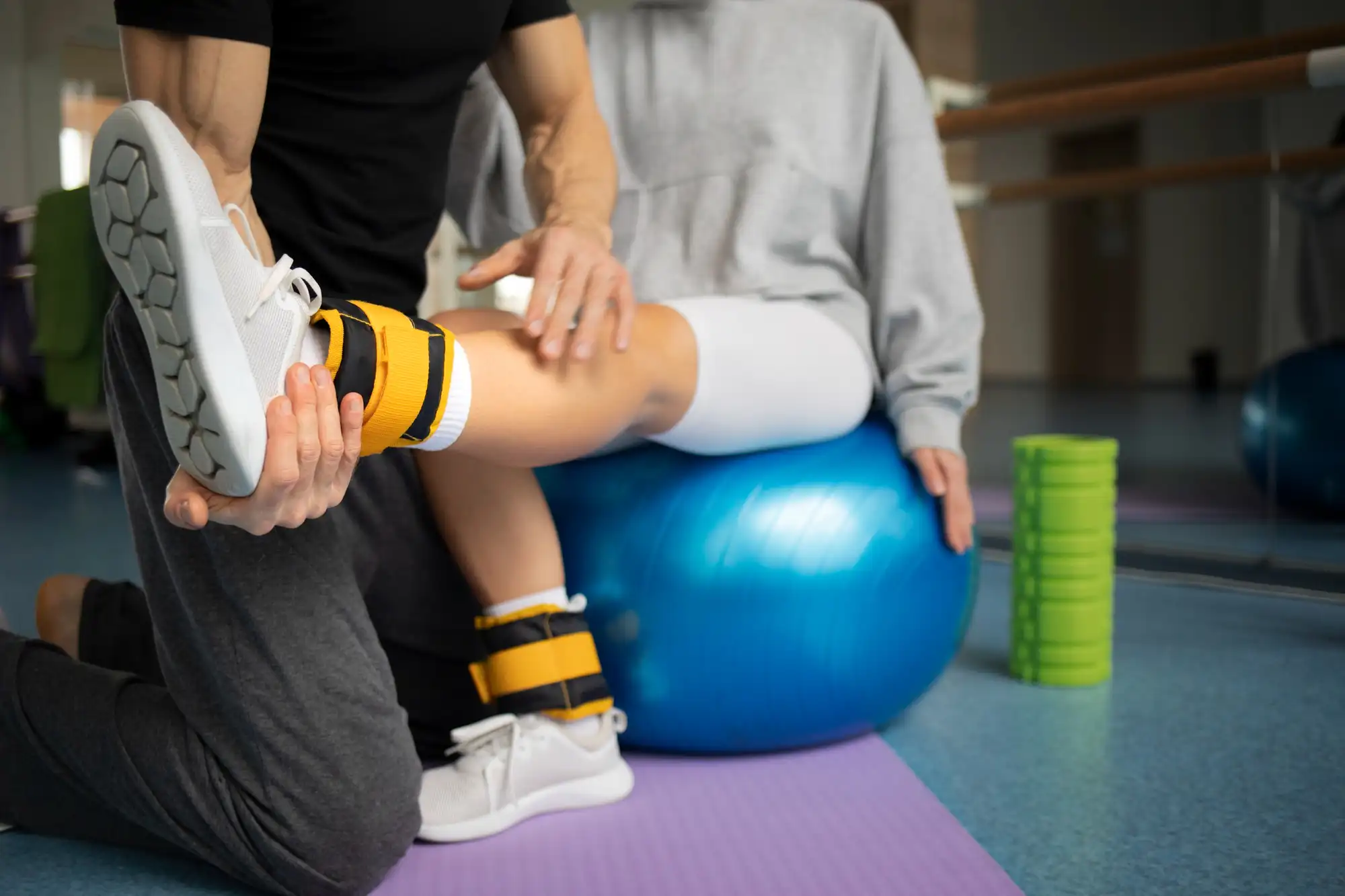Trainer assisting student during a sports physical examination.