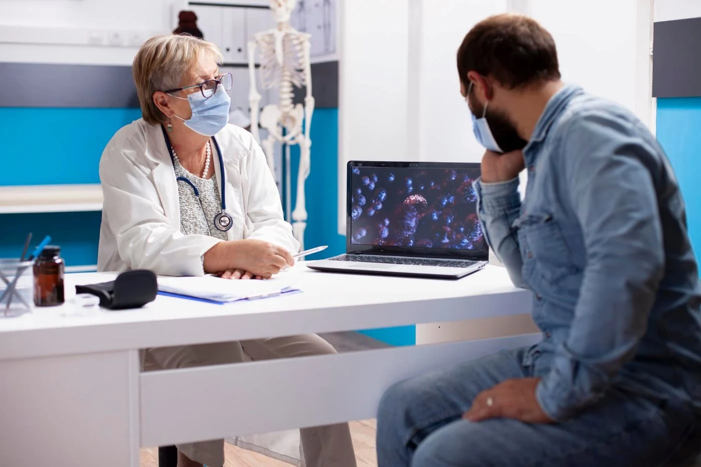 Physician reviewing lung scan results with a patient during a lung cancer screening appointment at Rapid Care clinic in Sanford NC