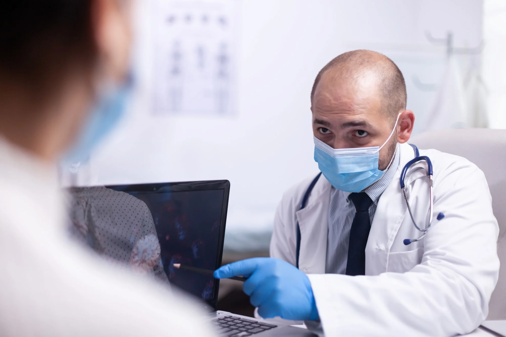 Healthcare provider discussing routine preventive screenings and cancer prevention strategies with a patient.