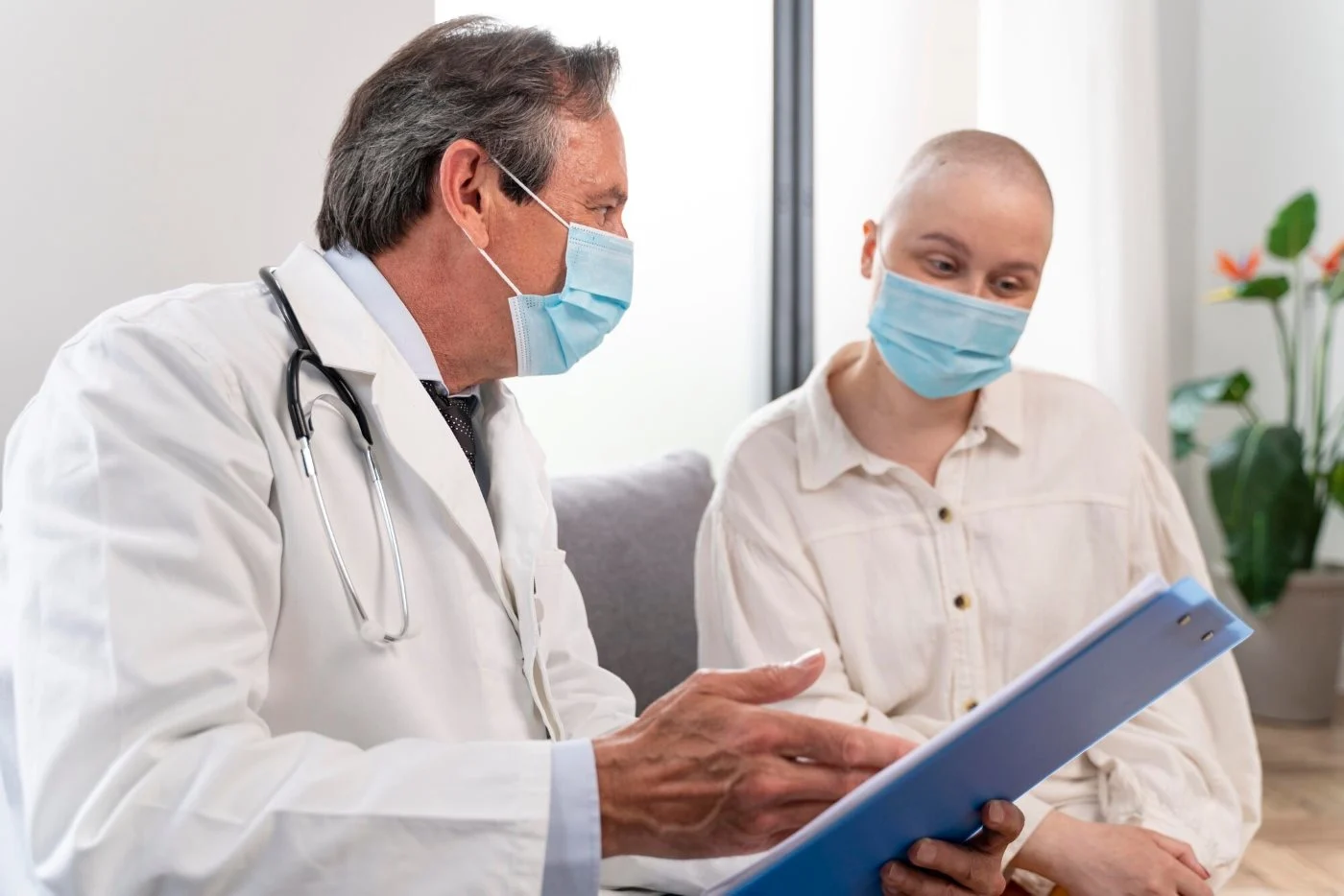 Medical provider discussing symptoms, family history, and warning signs that may require cancer screening