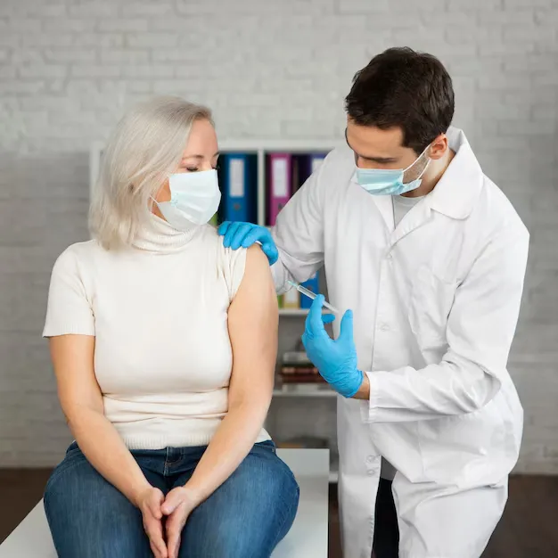 Doctor administering flu vaccine injection to patient in Fayetteville, NC