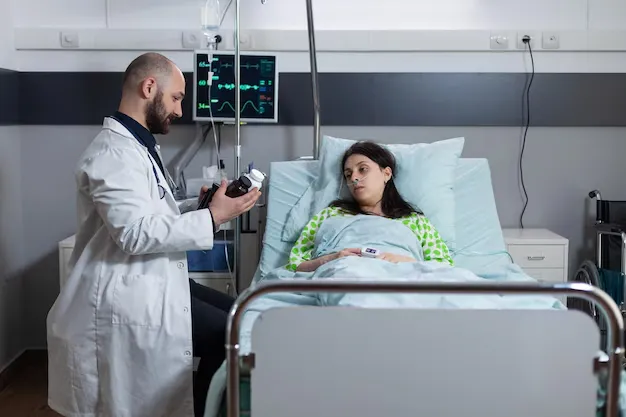 Doctor consulting hospitalized flu patient to prevent complications