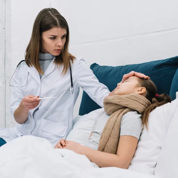 Doctor checking sick child for flu symptoms in Fayetteville, NC